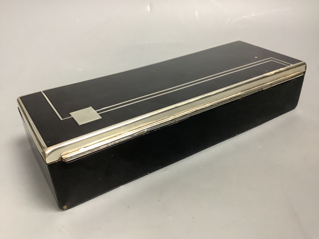 An Art Deco black enamel and chrome cigarette box